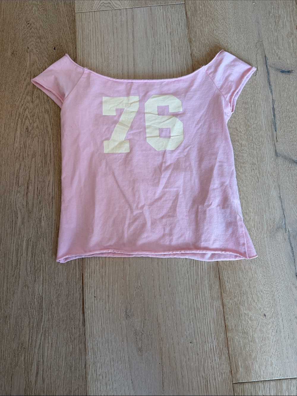 Edikted Pink Off-Shoulder Tee with Cream 76 Graphic